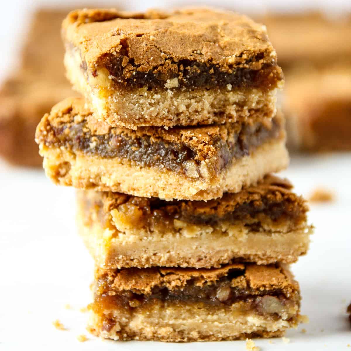 A stack of four butter tart squares.