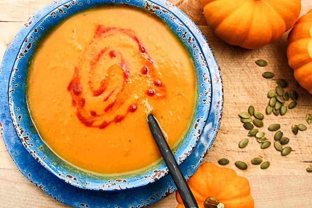 A bowl of soup with a spoon