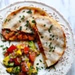 A plate of food with a with Quesadillas and Salsa