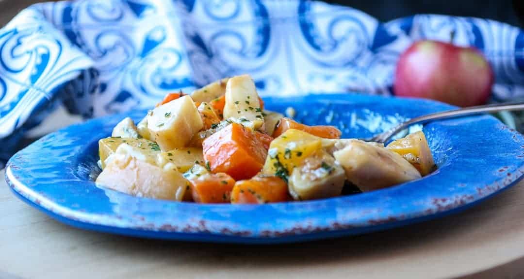 Food on a blue plate, chicken and Rutabaga