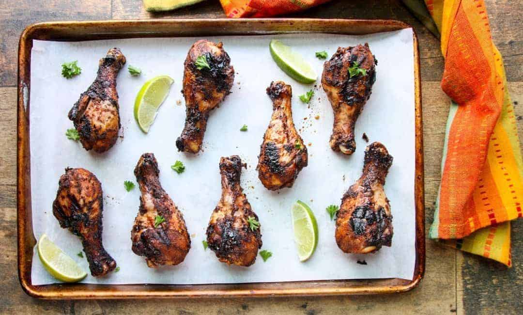 A pan of grilled chicken drumsticks