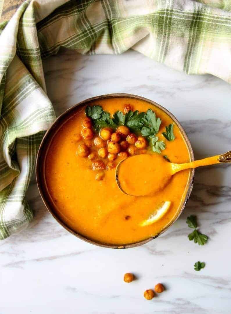 A bowl of soup with a spoon