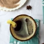 A top down view of a drink in a glass with ice