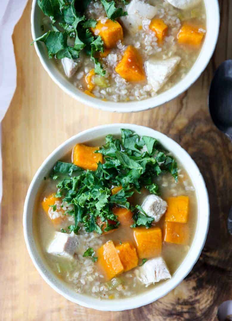 Two bowls of soup on a table