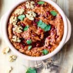 A bowl of dip on a table