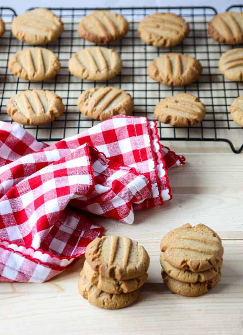 Stacks of gluten-free cookies on a table.
