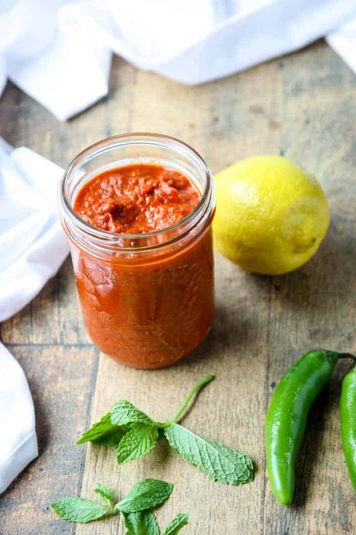 A close up of hot sauce in a jar