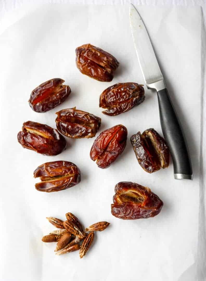 Dates with pits removed and a paring knife
