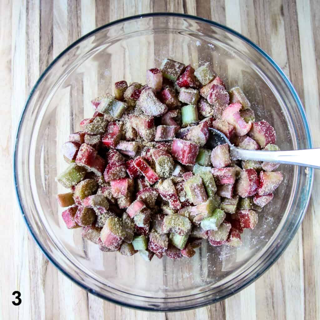 Rhubarb being mixed with the filling ingredients.