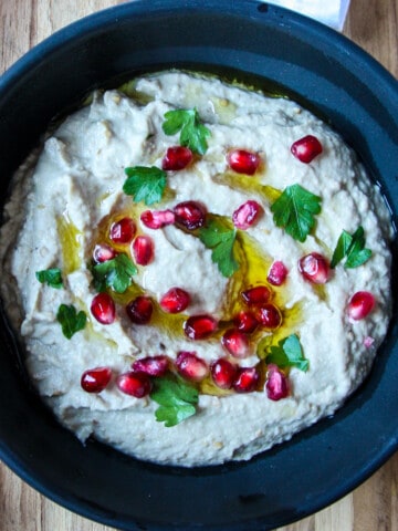 Mutabbal eggplant dip in a black dish.