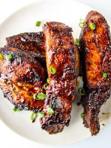Air fryer country style ribs covered in barbecue sauce.