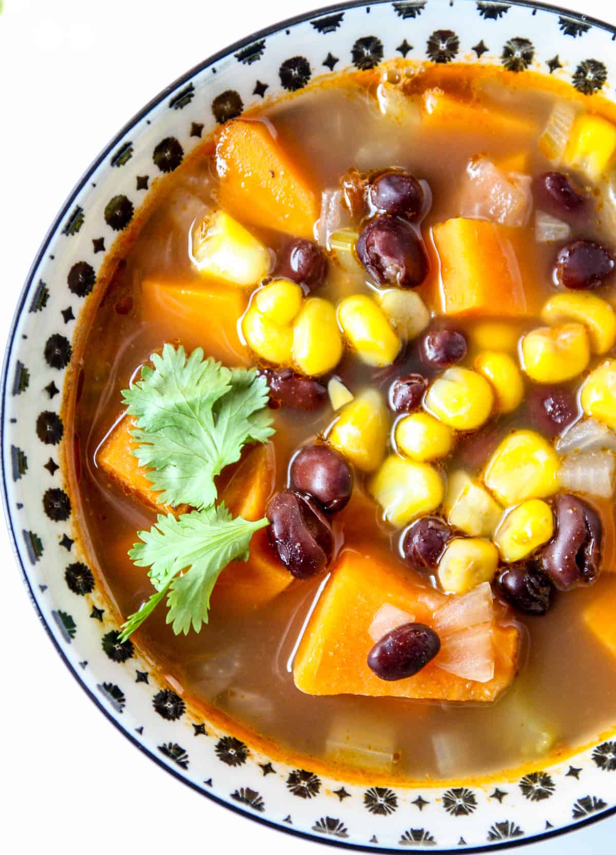 Sweet potato black bean soup in black & white bowl