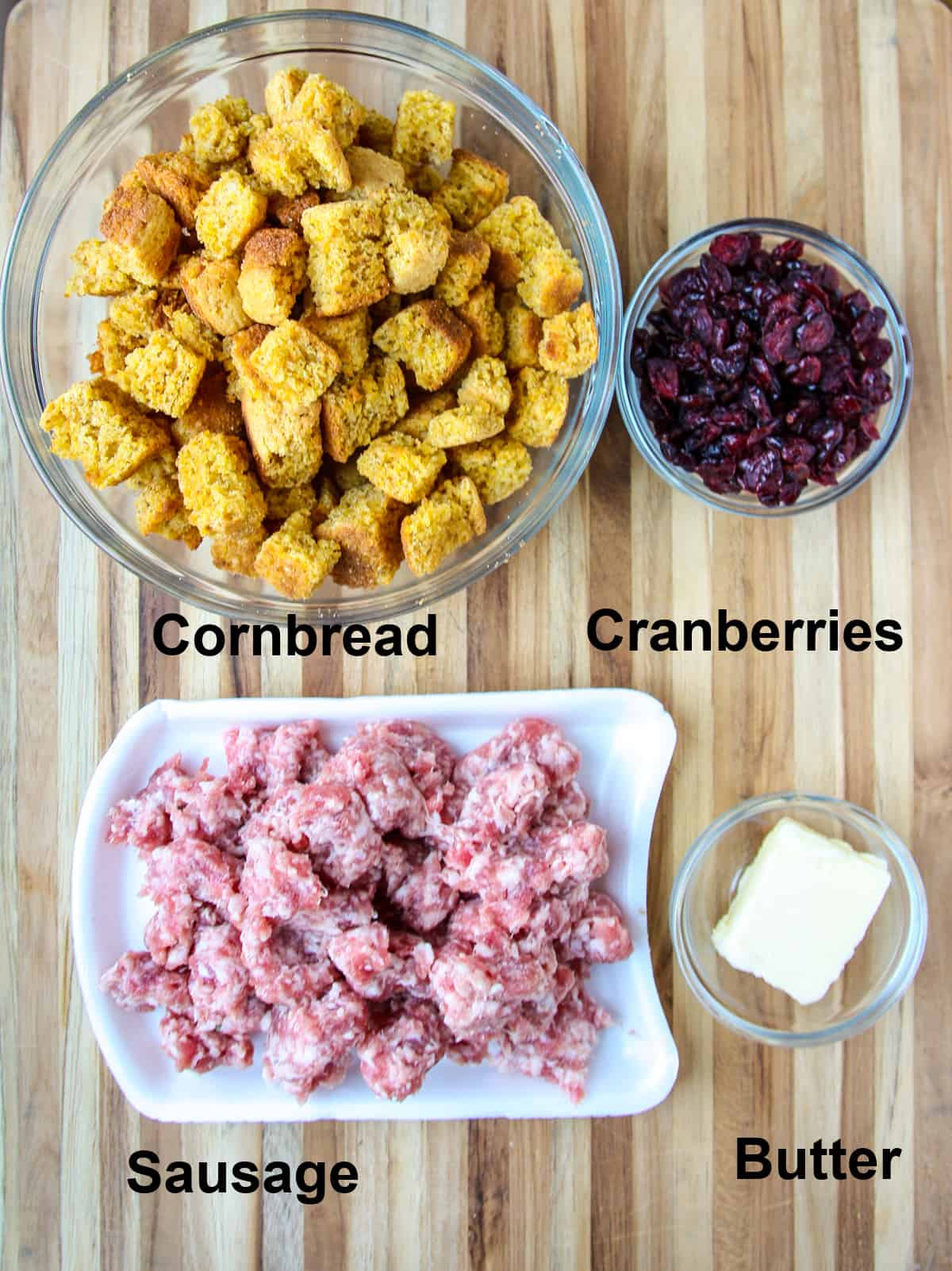 The main ingredients for the recipe; cornbread cubes, sausage meat and butter.