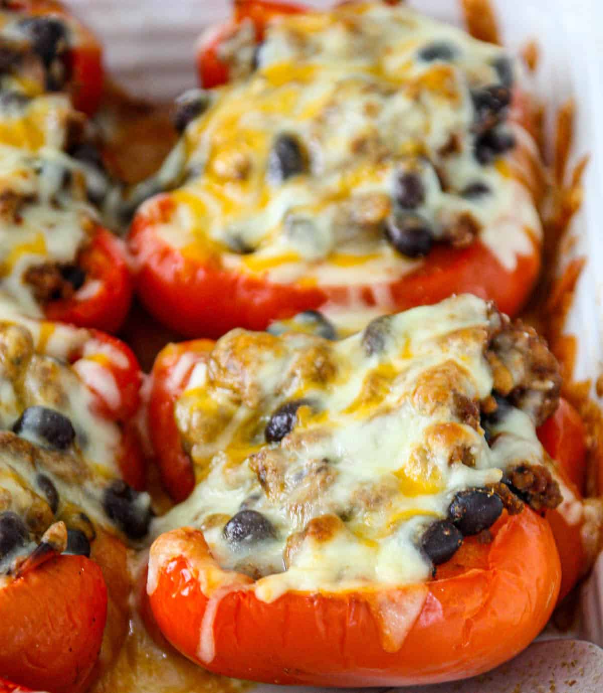 Baked taco stuffed peppers in a casserole dish.