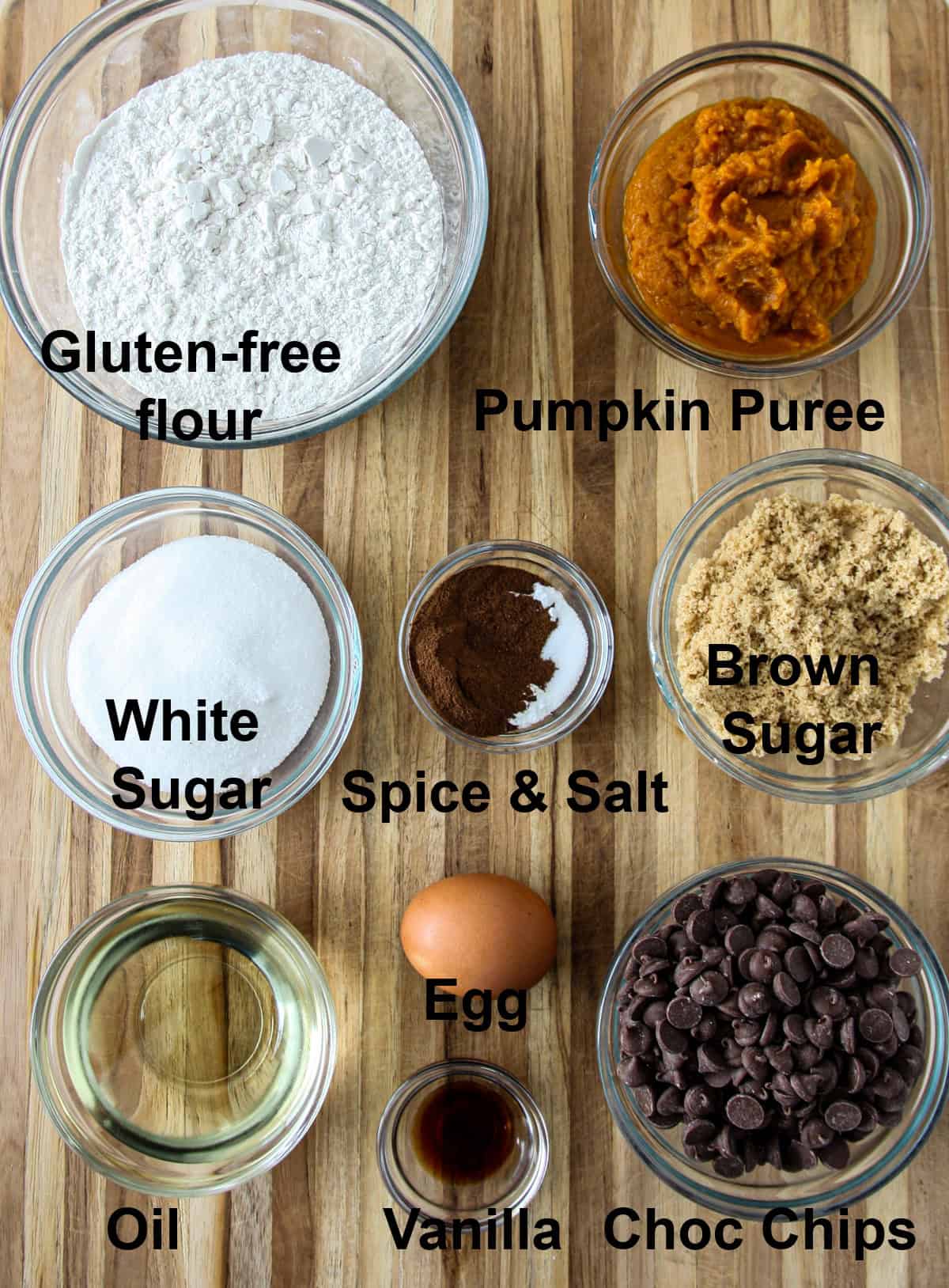 The ingredients for this recipe in glass bowls on a wooden board.