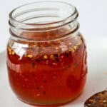 Hot honey sauce in a glass jar.